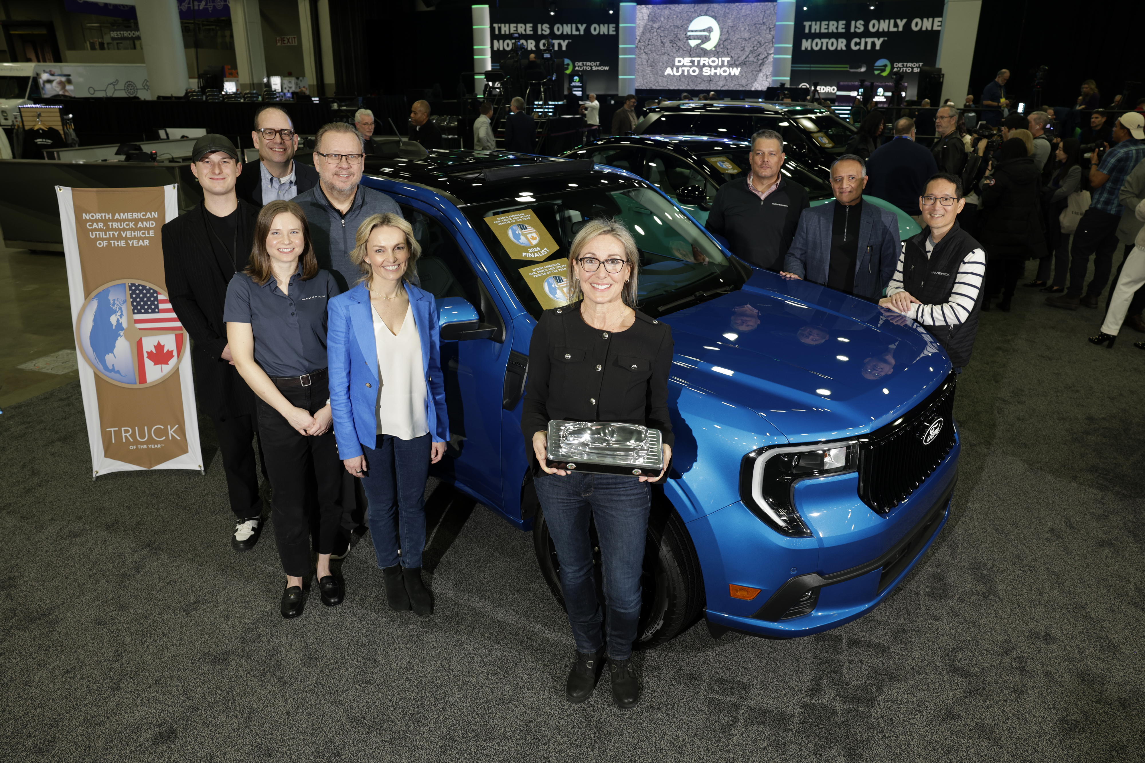 Ford Maverick Lobo team accepting North American Truck of the Year award for 2026