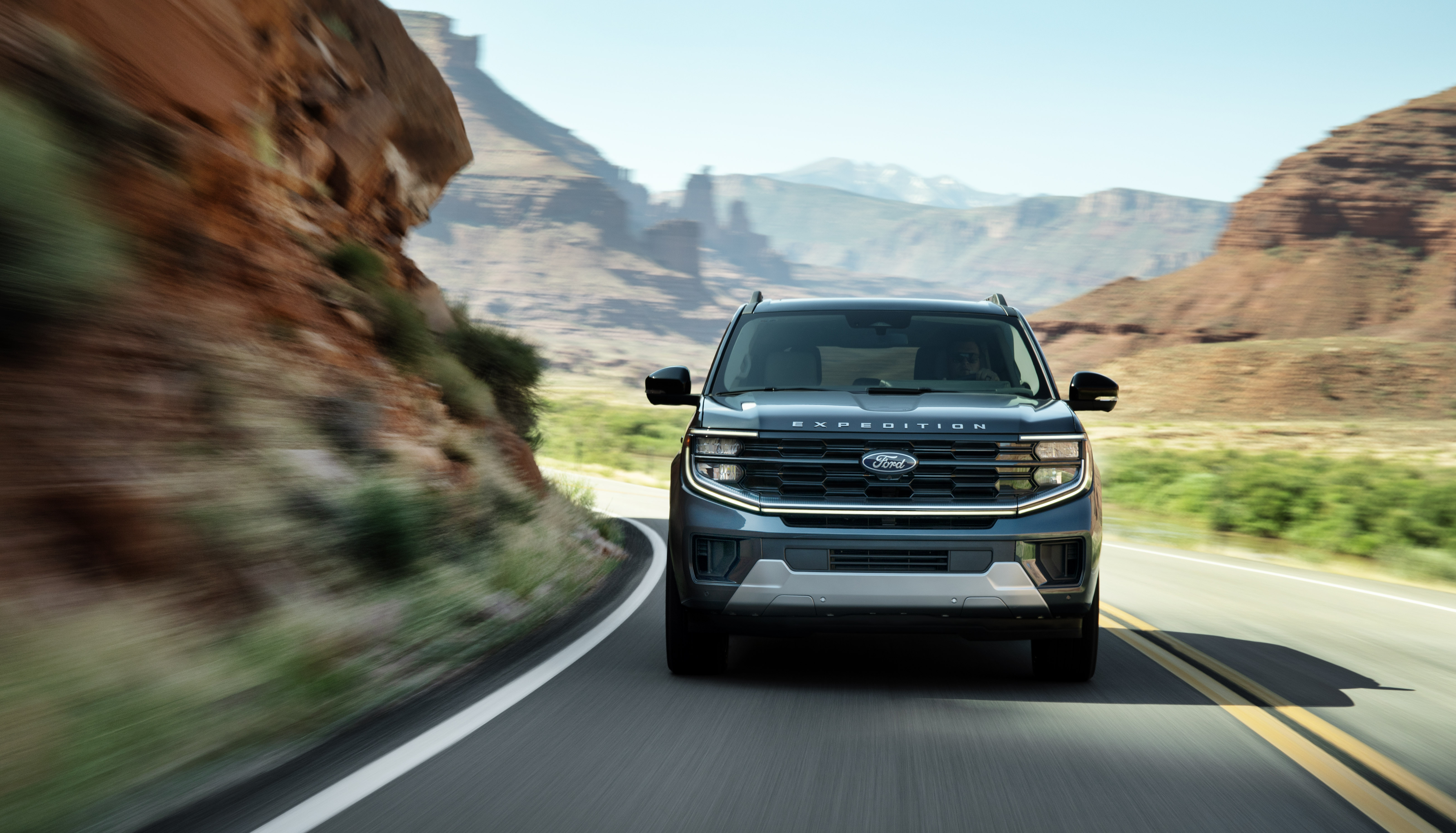 2025 Ford Expedition Platinum driving in a mountainous area