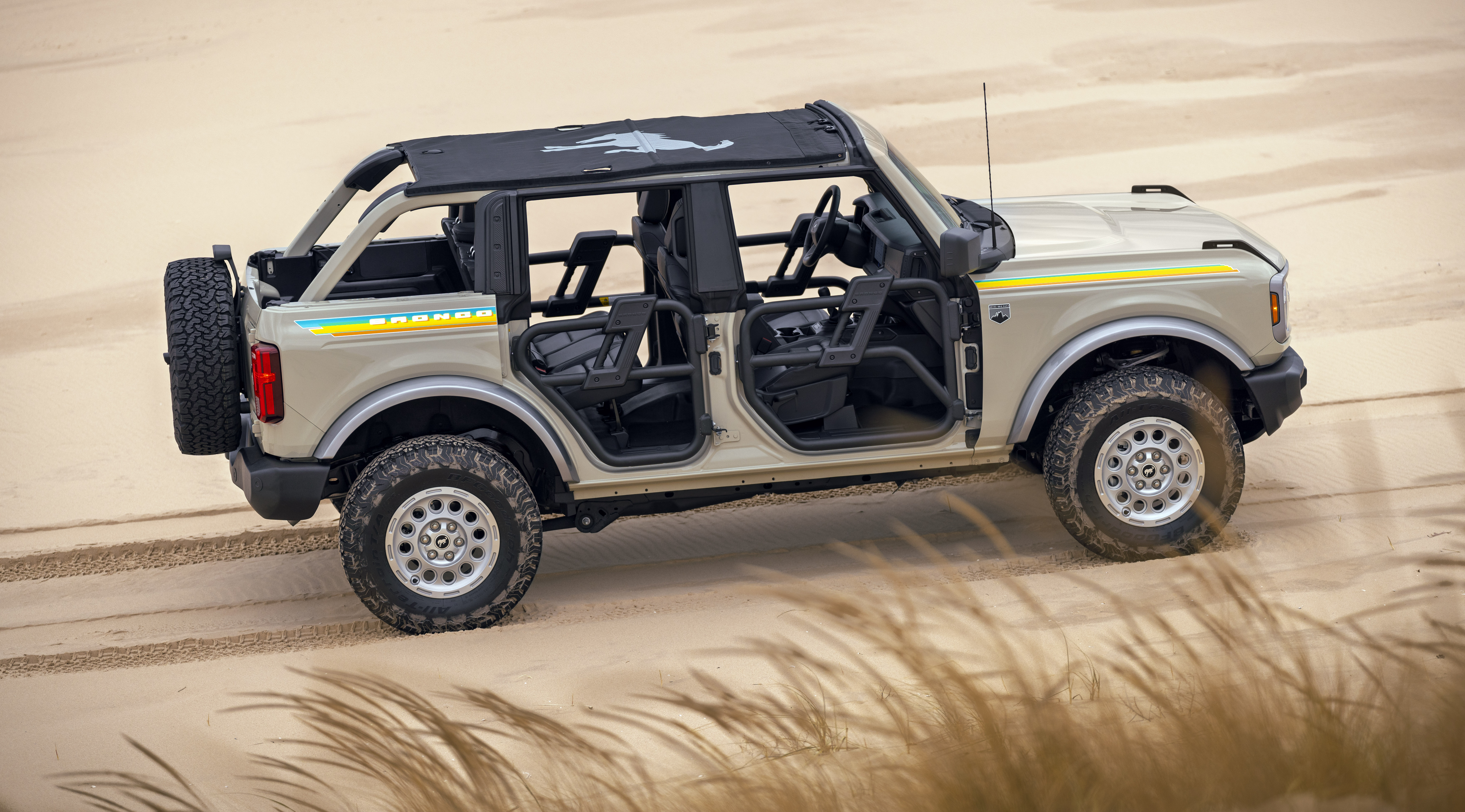 A Ford Bronco with the Ford Custom Garage Coastal Package is parked on the beach.