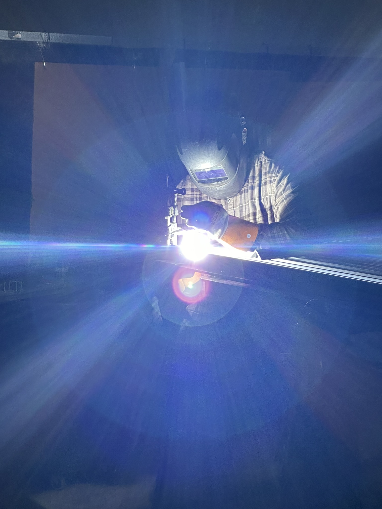 A person in welding mask works 