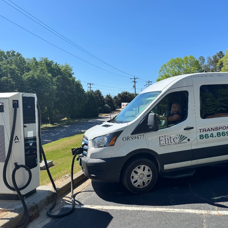 Elite Home Care's E-Transit van plugged into a DC Fast Charger.