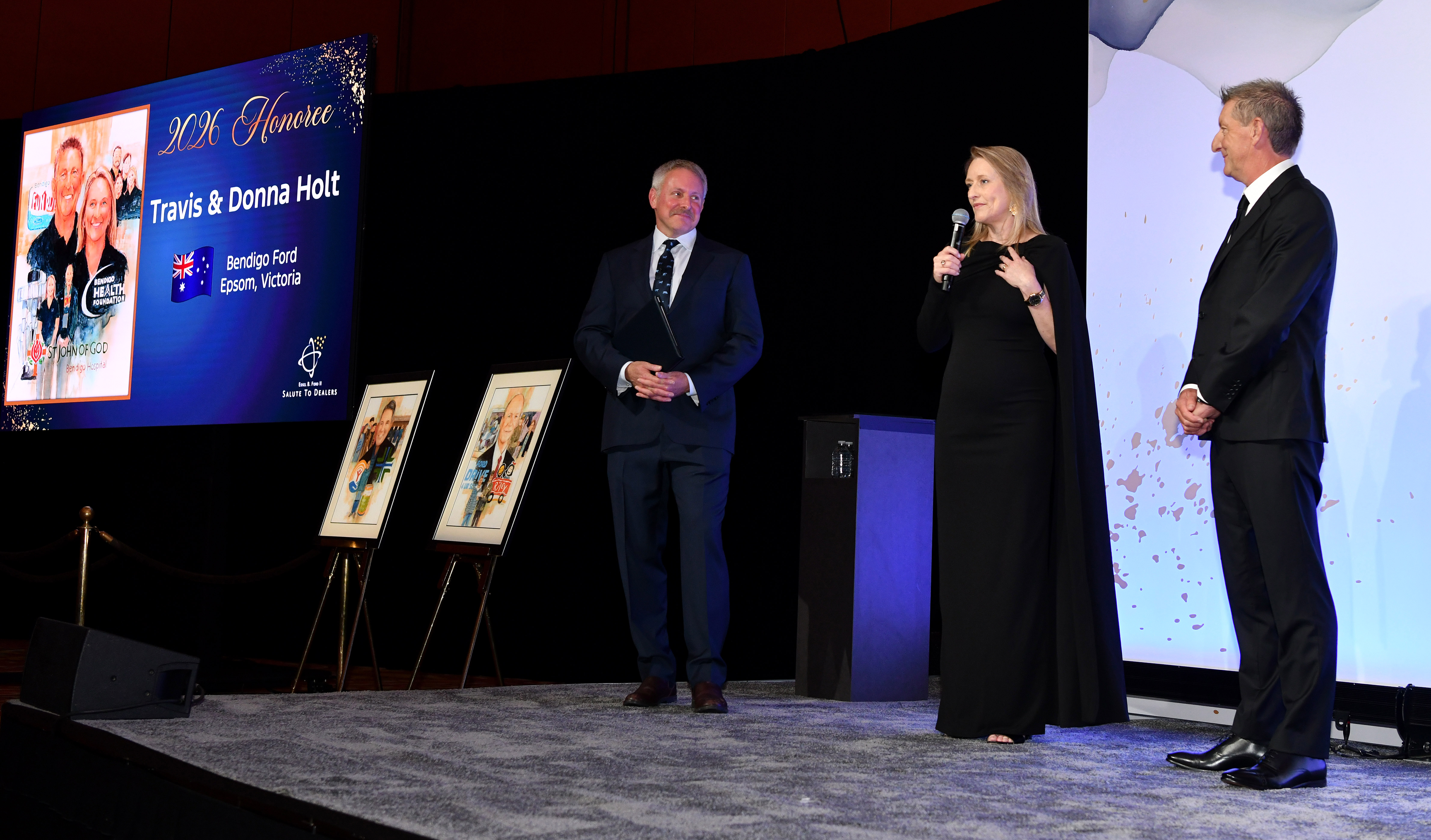 LAS VEGAS,  Feb. 3, 2026 — Henry Ford III recognized the Ford Motor Company 2026 Salute to Dealers honorees at a reception on Feb. 3 in Las Vegas. For the past 26 years, Salute to Dealers, has recognized Dealer Principals who have made an extraordinary commitment to helping their communities through their support of countless charitable and philanthropic causes. This year, eight dealers were honored. Pictured: Henry Ford III, Donna Holt and Travis Holt.Photo by: Sam VarnHagen