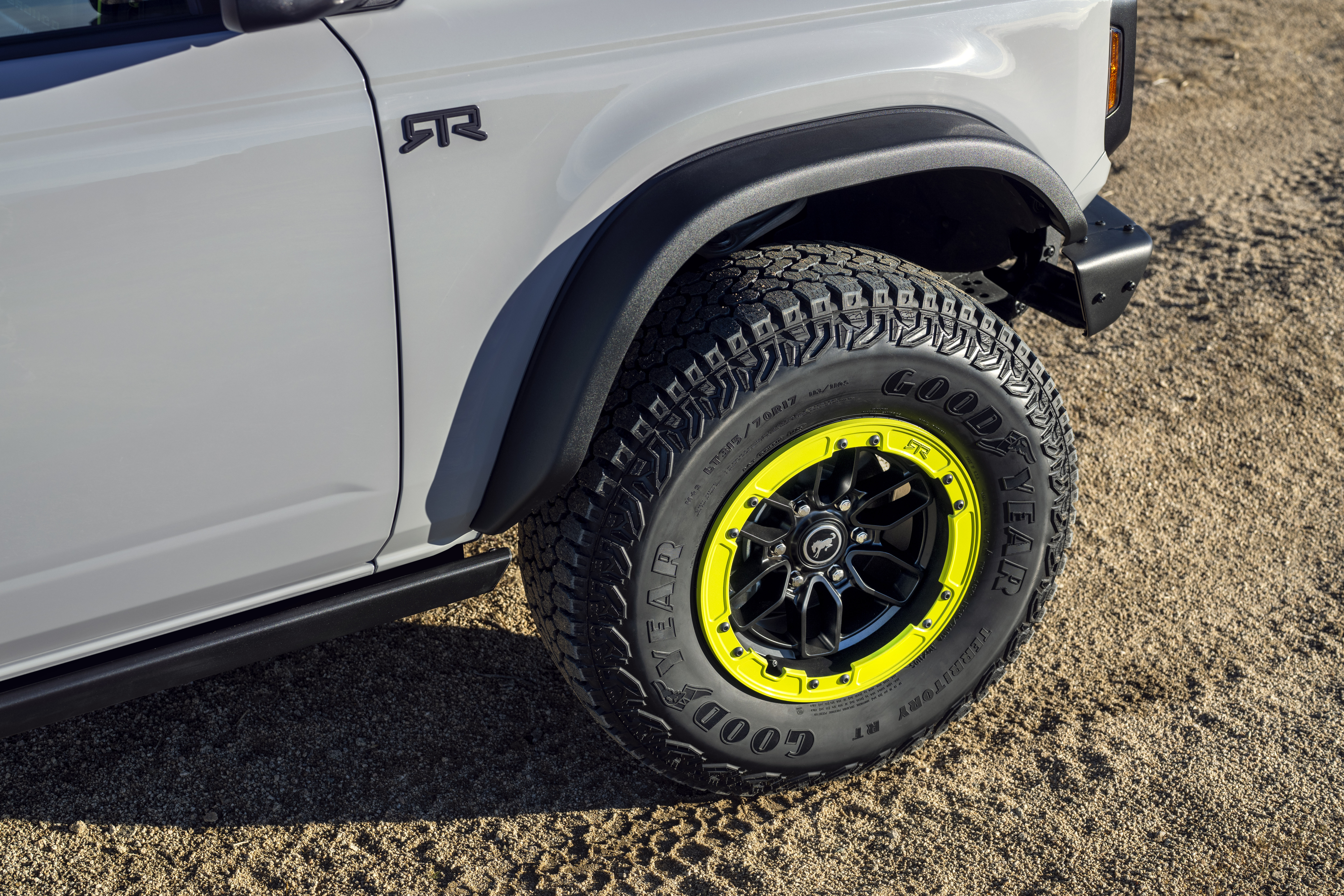 The front end of the Bronco RTR shows the RTR logo on the side of the vehicle and lime green accents in the wheel.