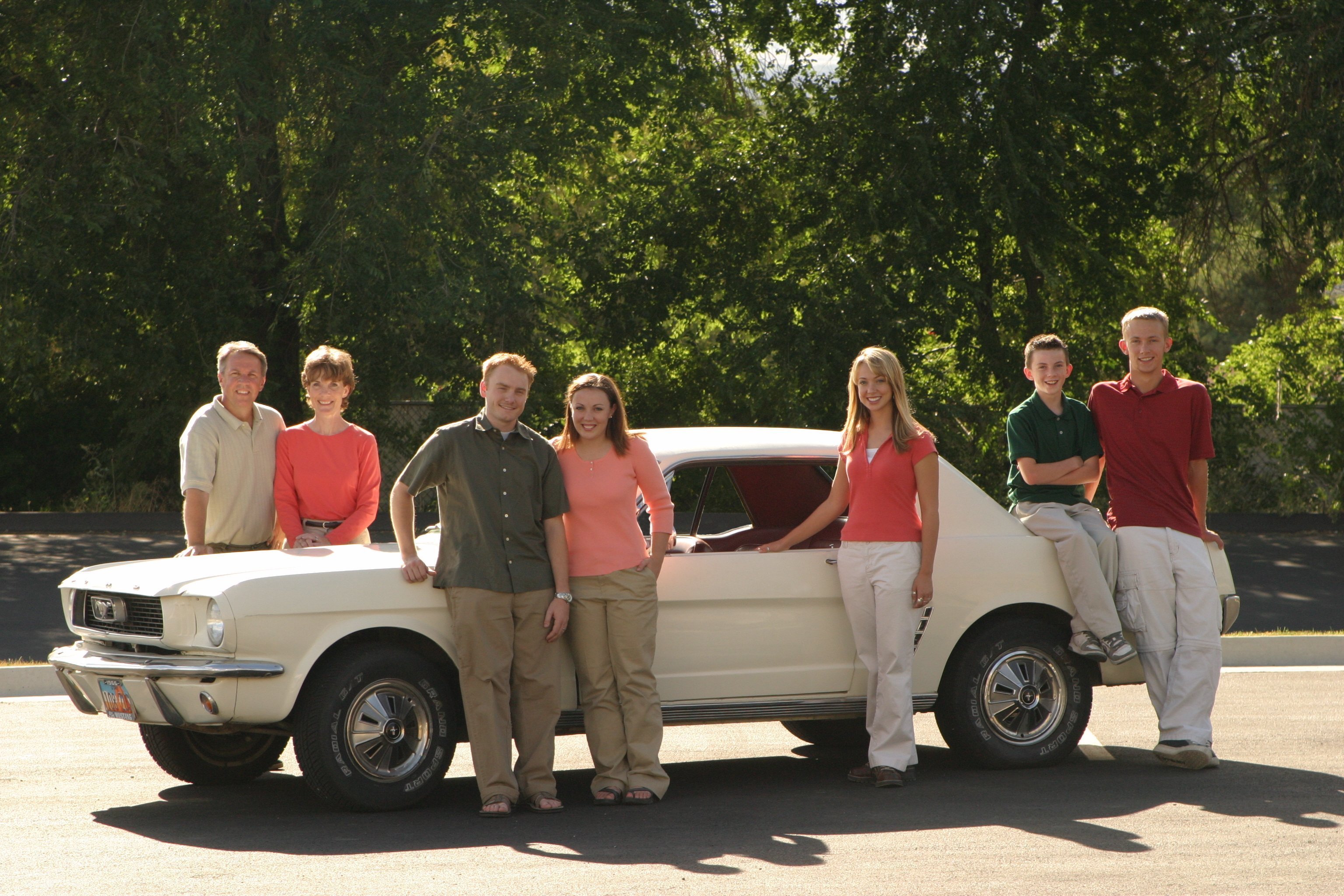 The family Mustang is at the center of each family photo from 1998 to 2025.