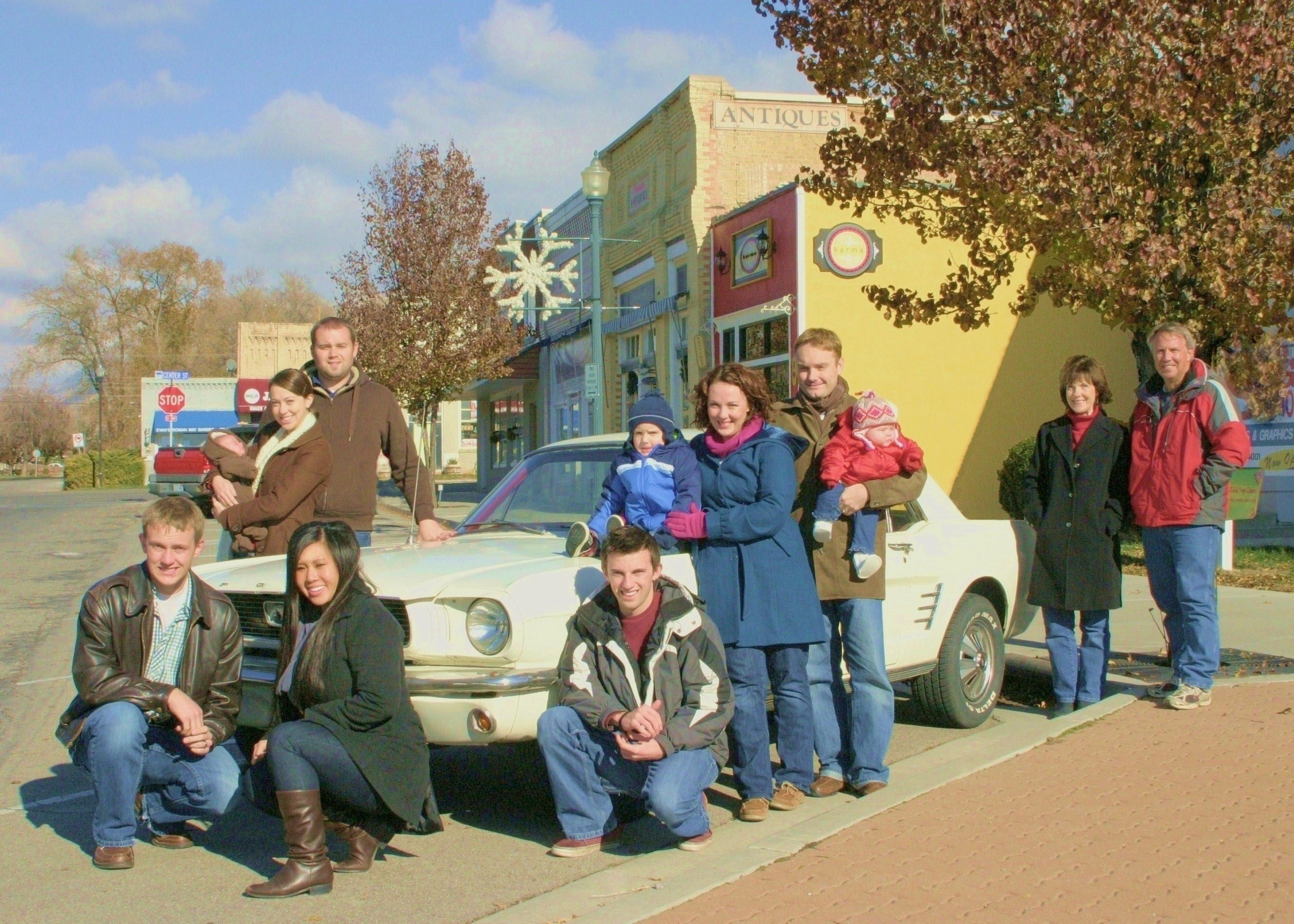 The family Mustang is at the center of each family photo from 1998 to 2025.