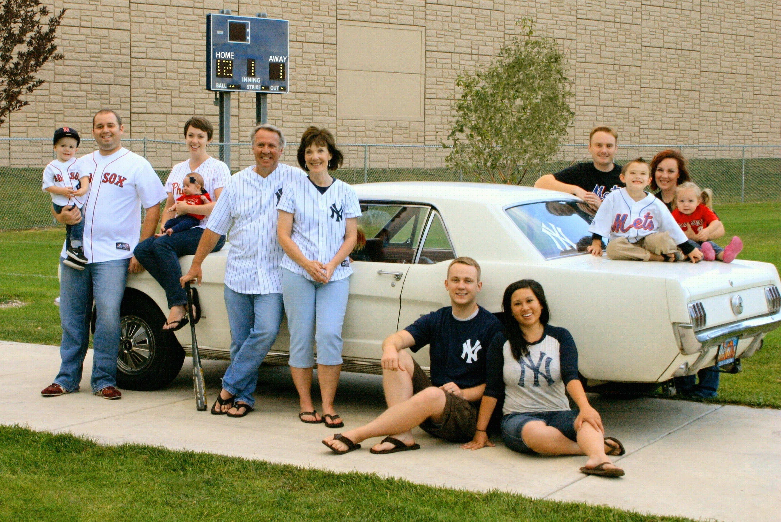The family Mustang is at the center of each family photo from 1998 to 2025.