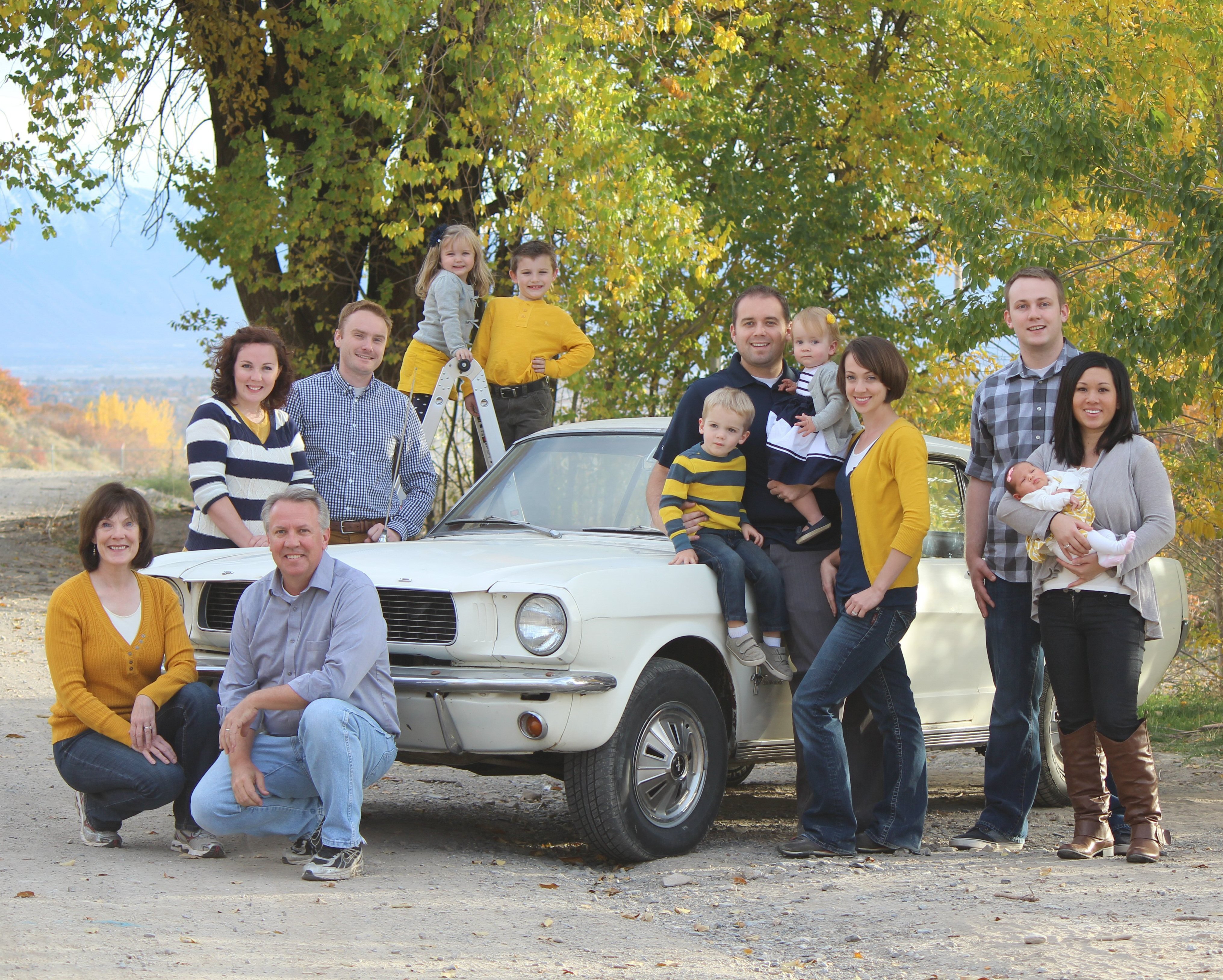 The family Mustang is at the center of each family photo from 1998 to 2025.