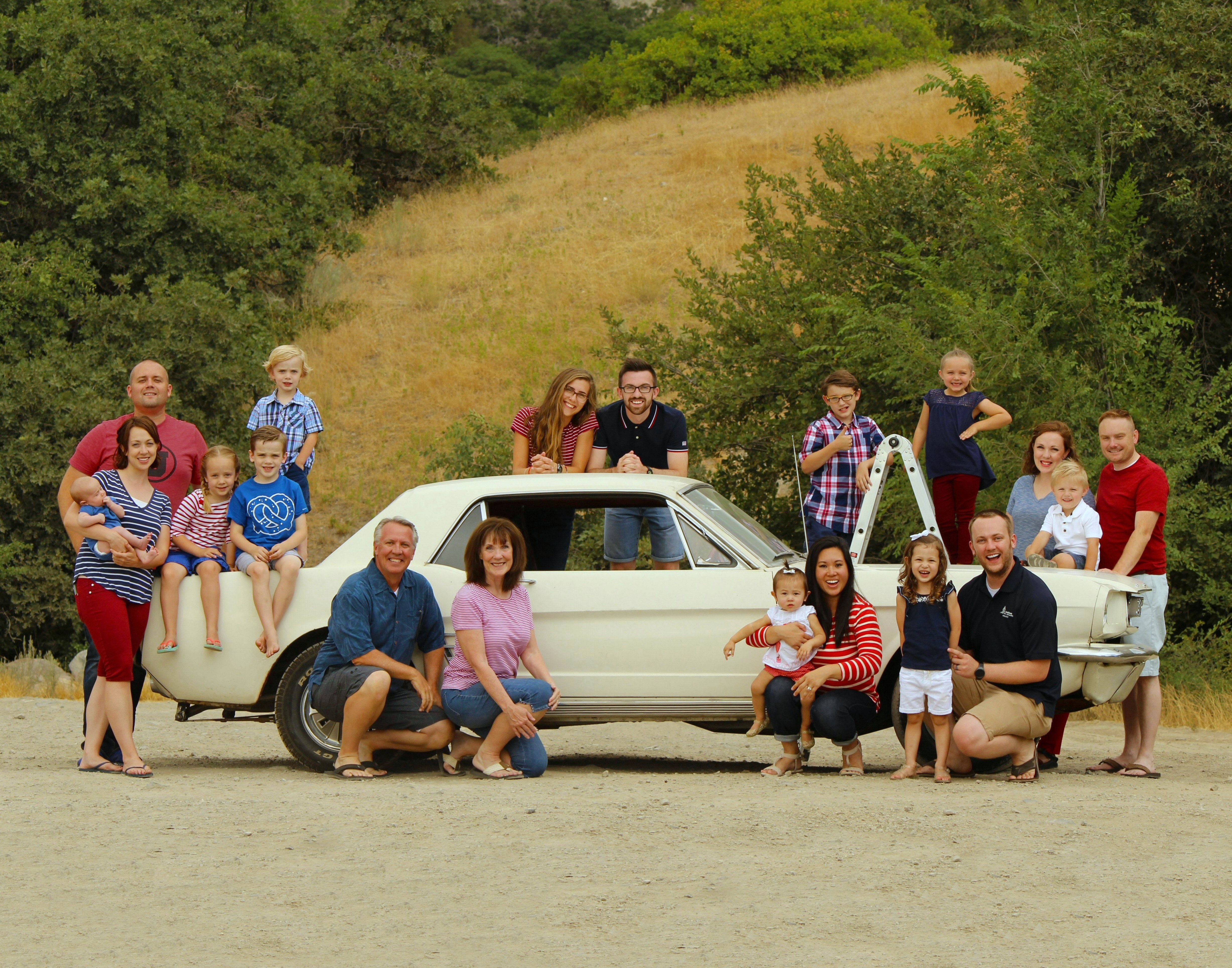 The family Mustang is at the center of each family photo from 1998 to 2025.