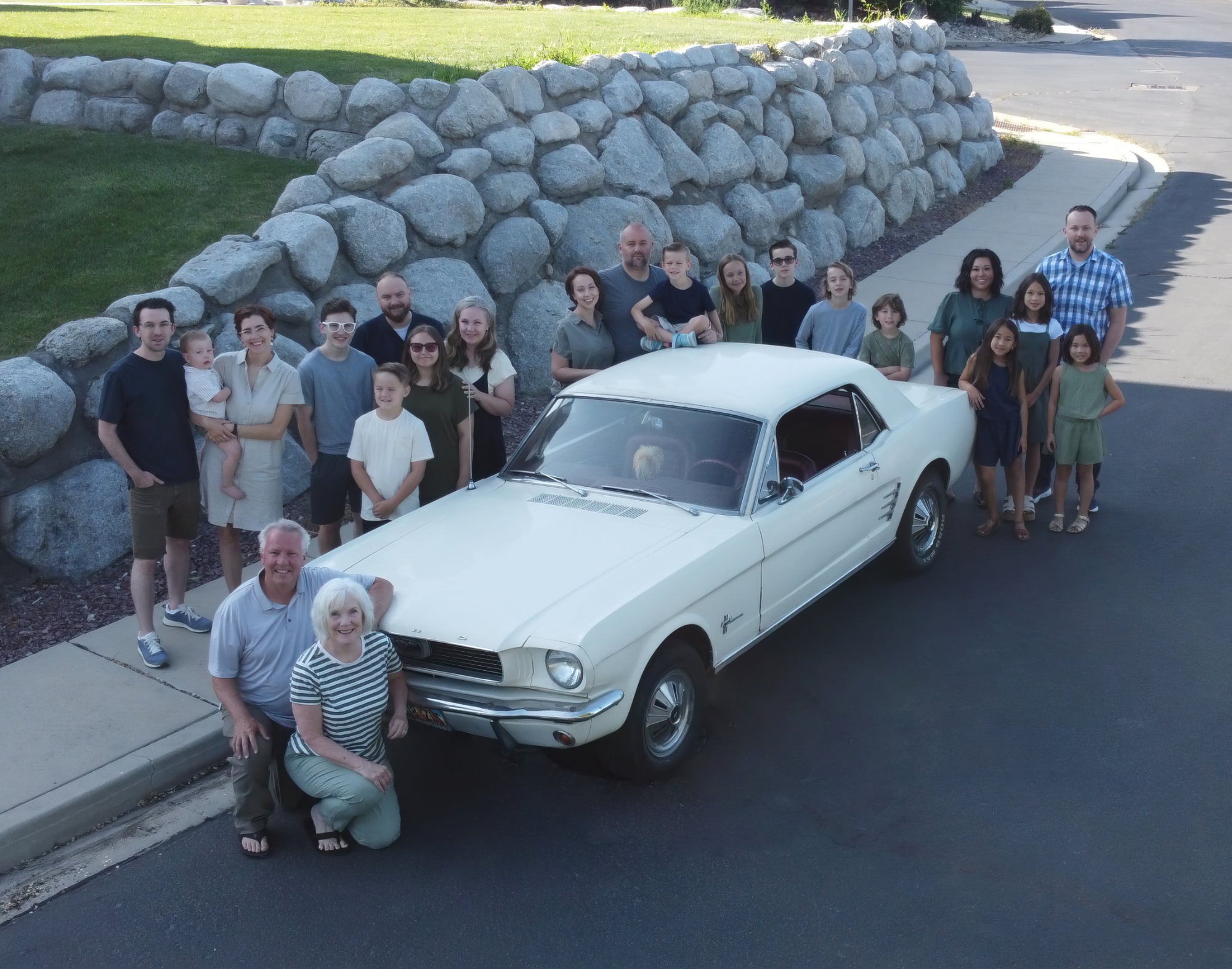 The family Mustang is at the center of each family photo from 1998 to 2025.
