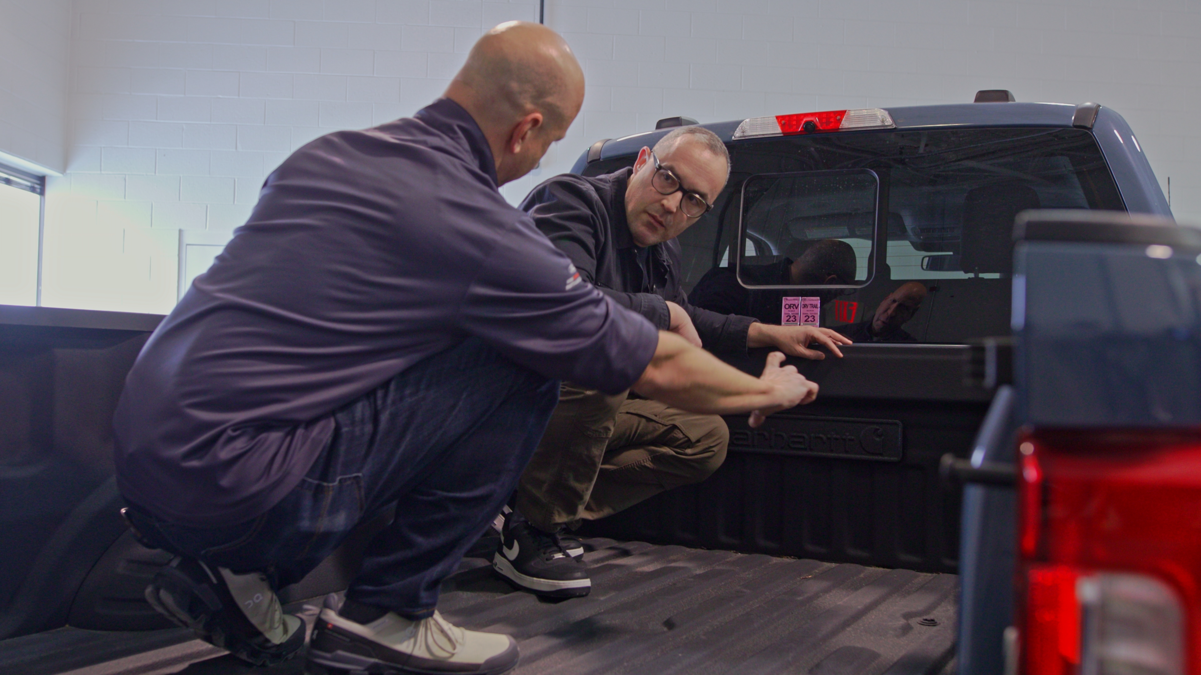 Steve Gilmore and Ben Ewy in the new 2027 Ford Super Duty Carhartt truck bed.